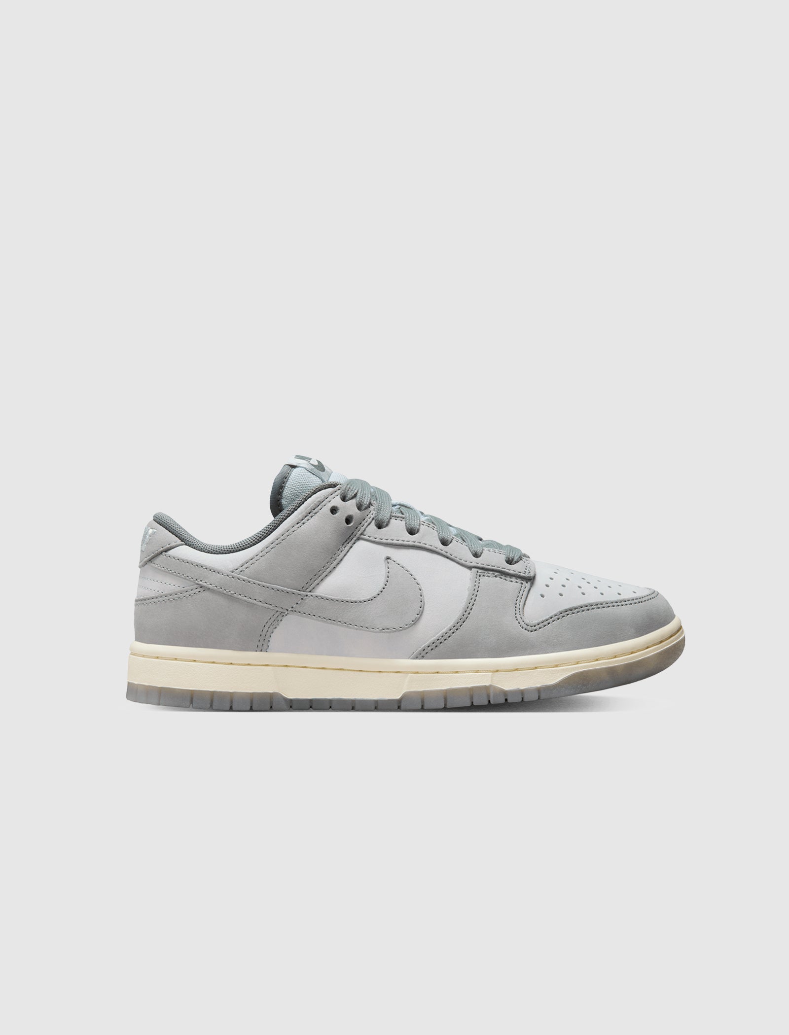 This Nike Dunk Low Features Mini Swoosh Details And A Wolf Grey