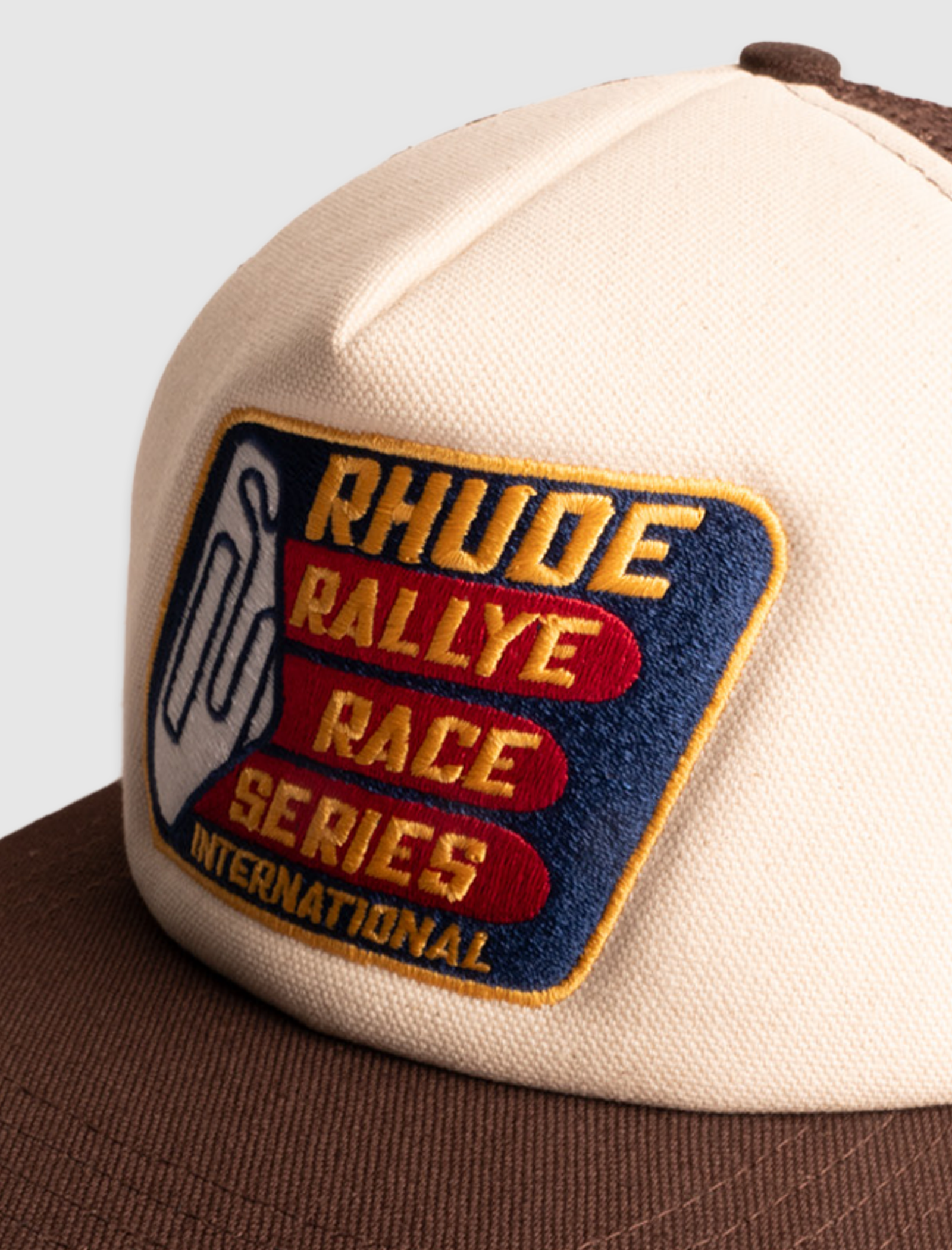 RHUDE RACE SERIES WASHED TRUCKER HAT